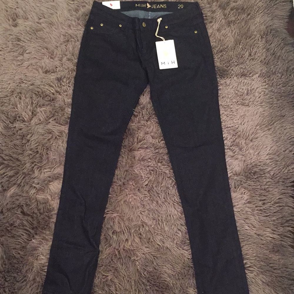 Dark denim jeans with zipper on bottom